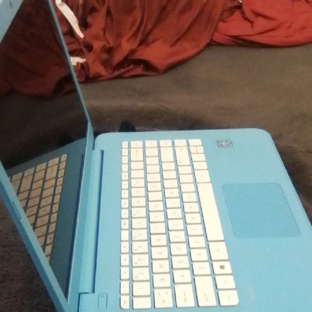 Blue Laptop with White Keyboard